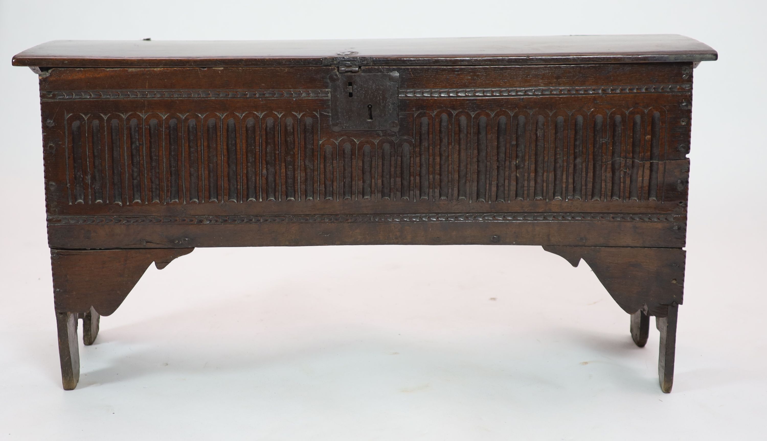 A 17th century oak six-plank chest H 64cm. W 124cm. D 38cm.